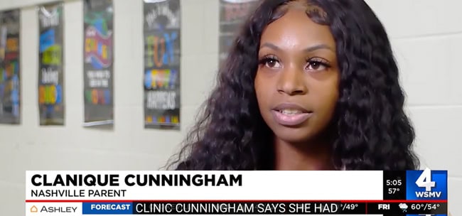 African-american mother is interviewed for TV news. 